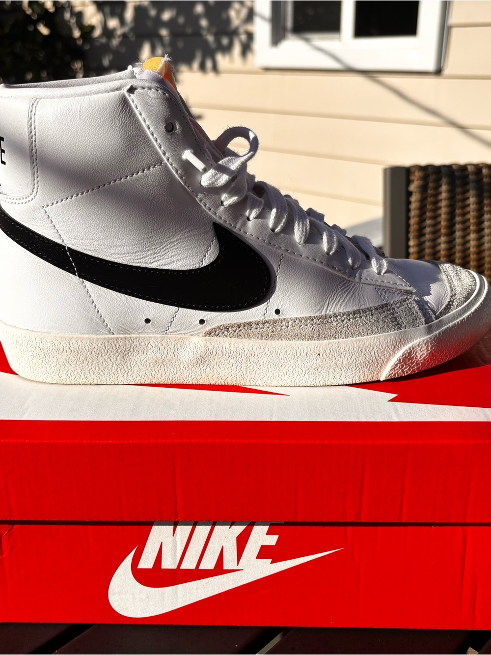 Nike White High-Top Sneakers with Black Swoosh and Red Box Accent